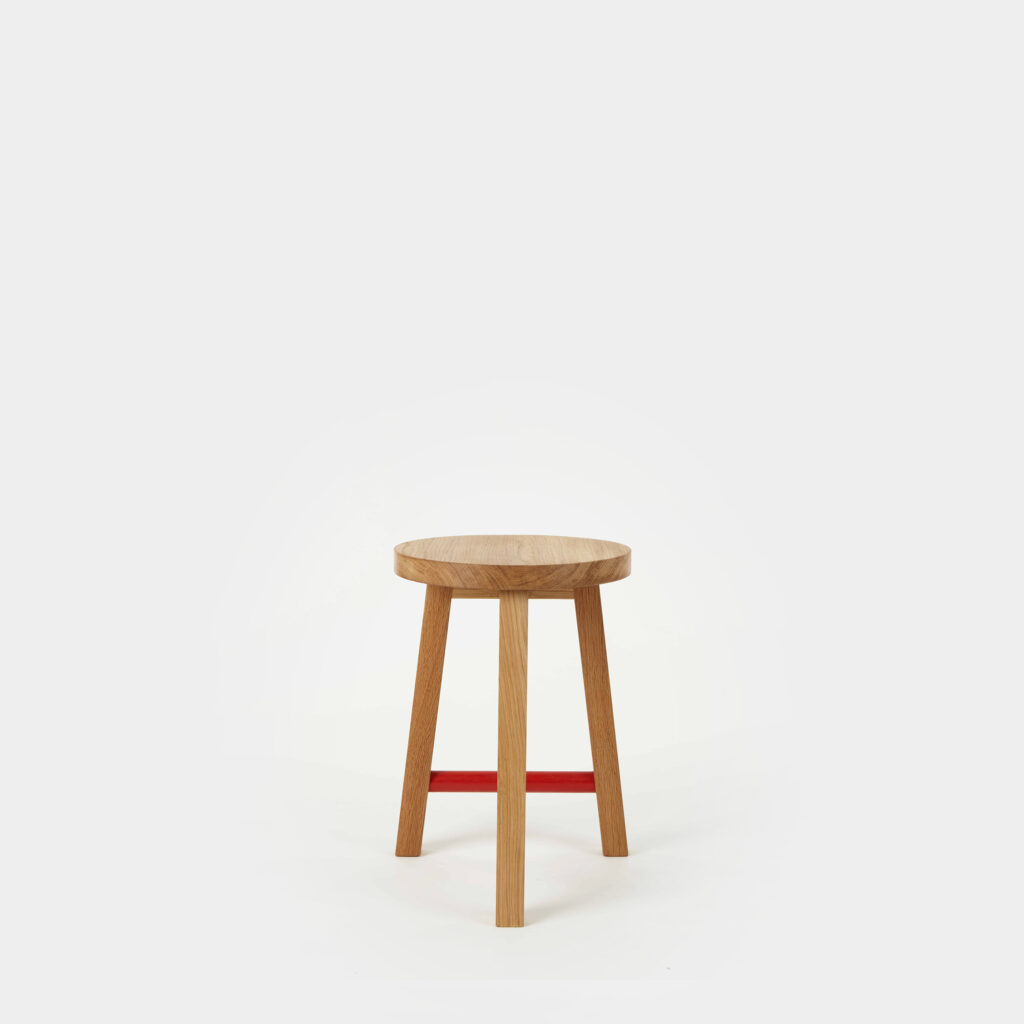 three-legged stool with cross dowel round seat; oak or ash